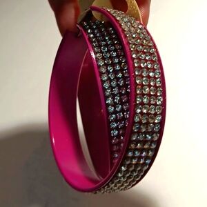 Big pink and rhinestone bangle earrings.